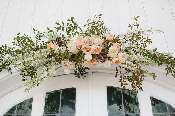 DIY floral doorway arch | DIY wedding decor | 100 Layer Cake