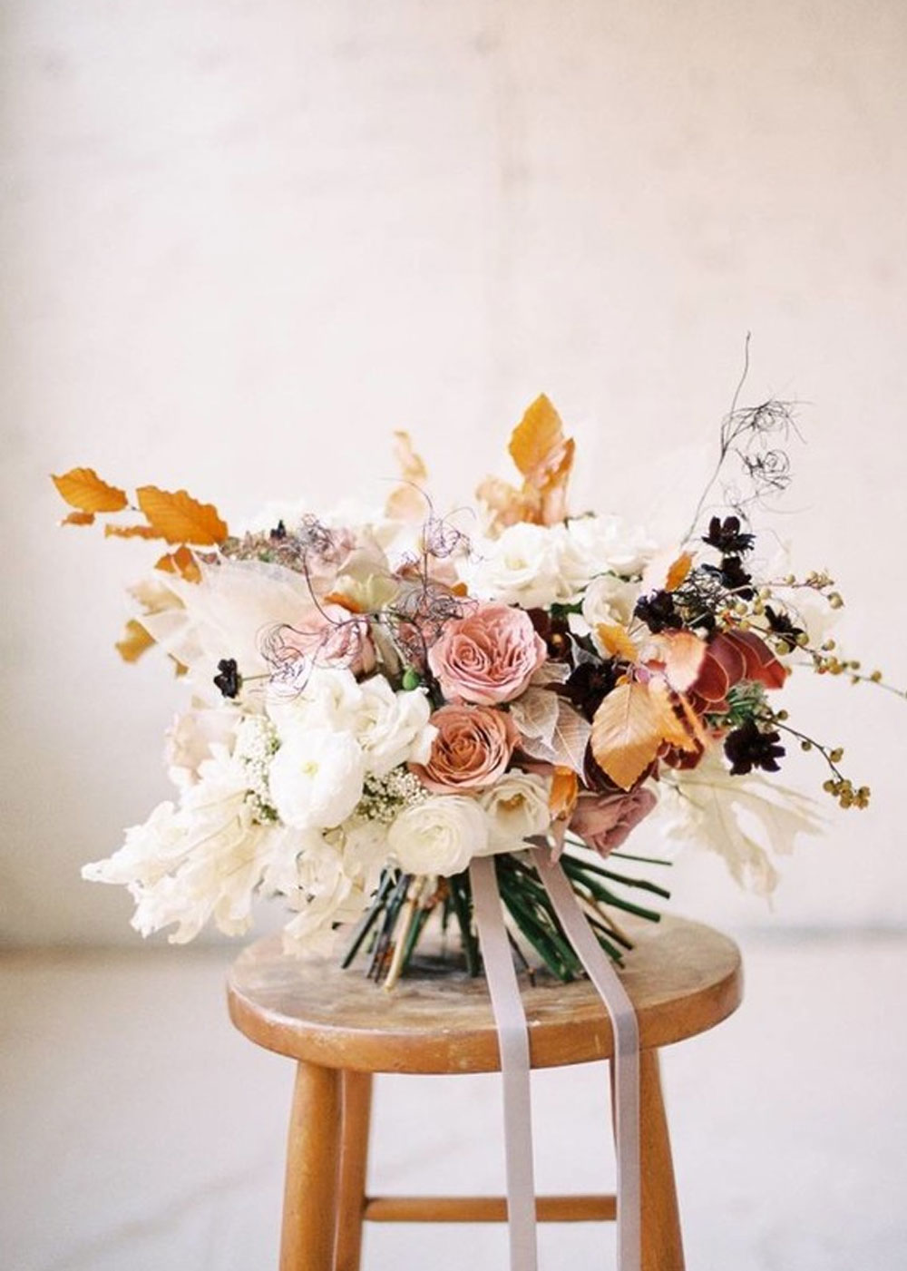 A bright, full autumn bouquet by Evergreen Flower Co complete with garden roses.