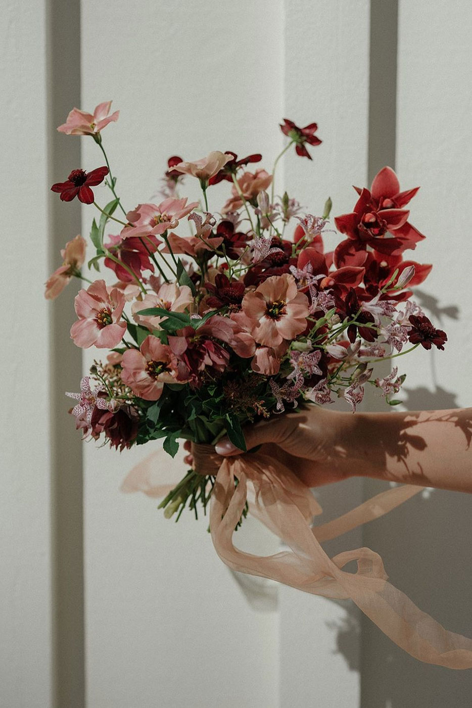 Red bridal bouquet by Unwritten Florals