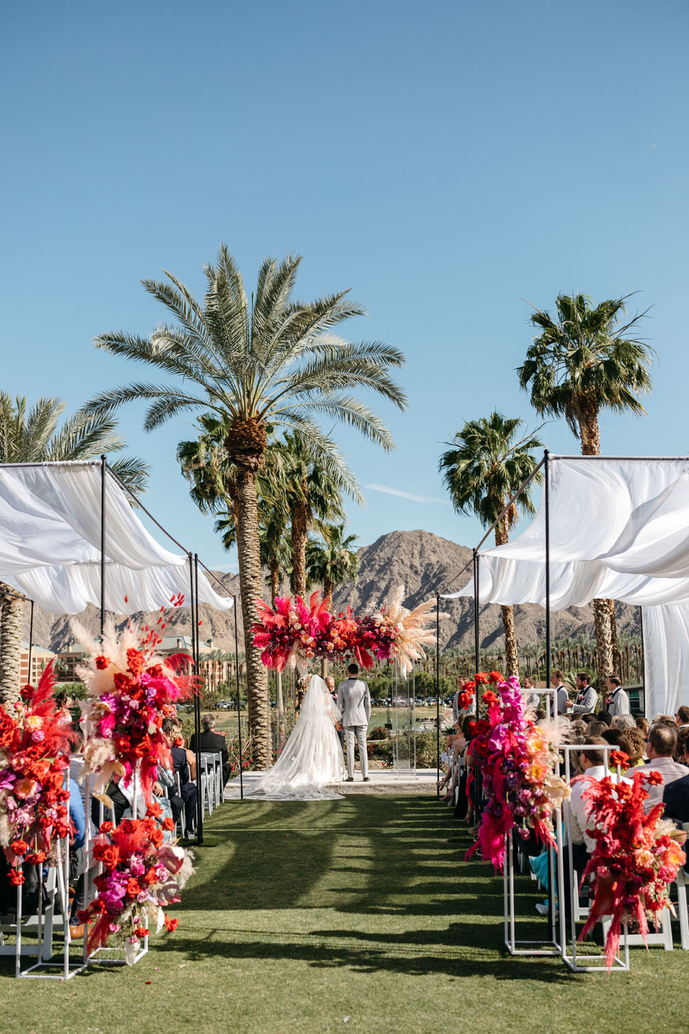 Electric pink and colorful wedding in the desert