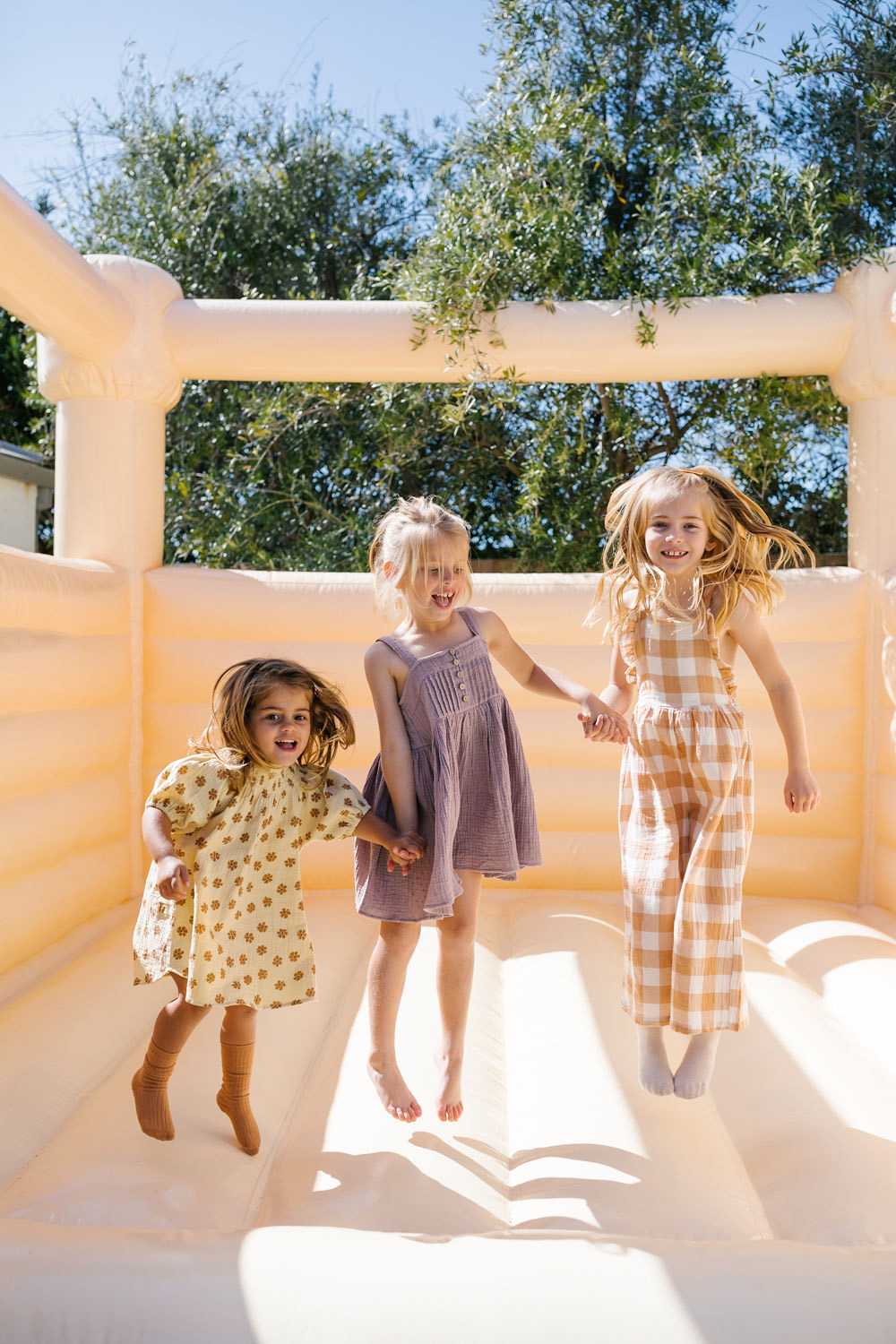 girls in bounce house at sister birthday party