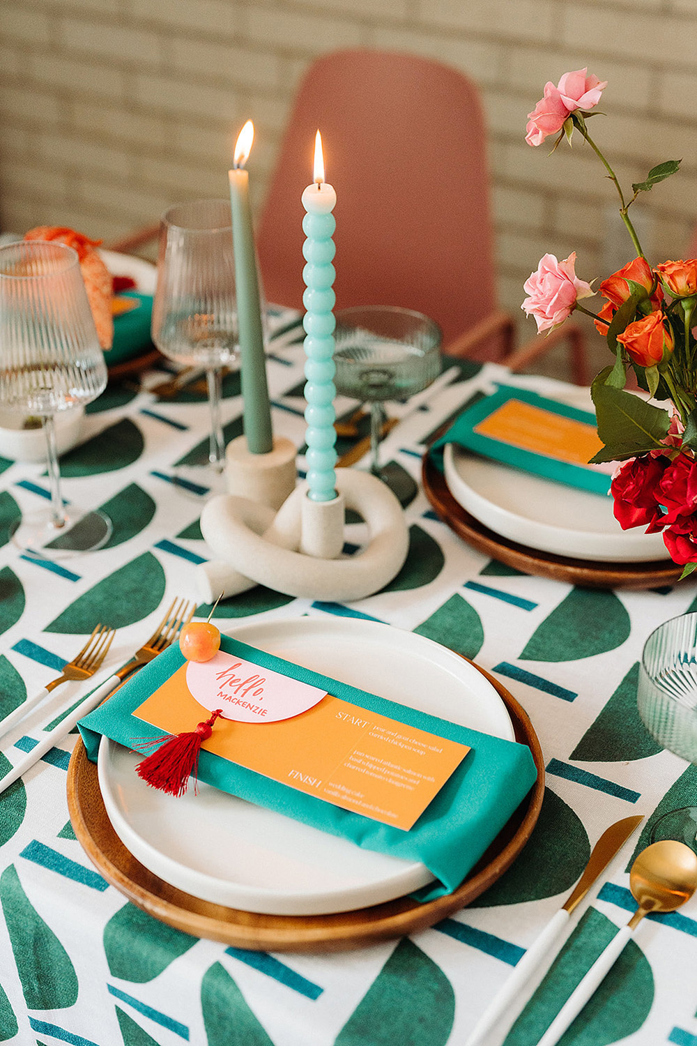 pink, orange, teal place settings for colorful gay wedding