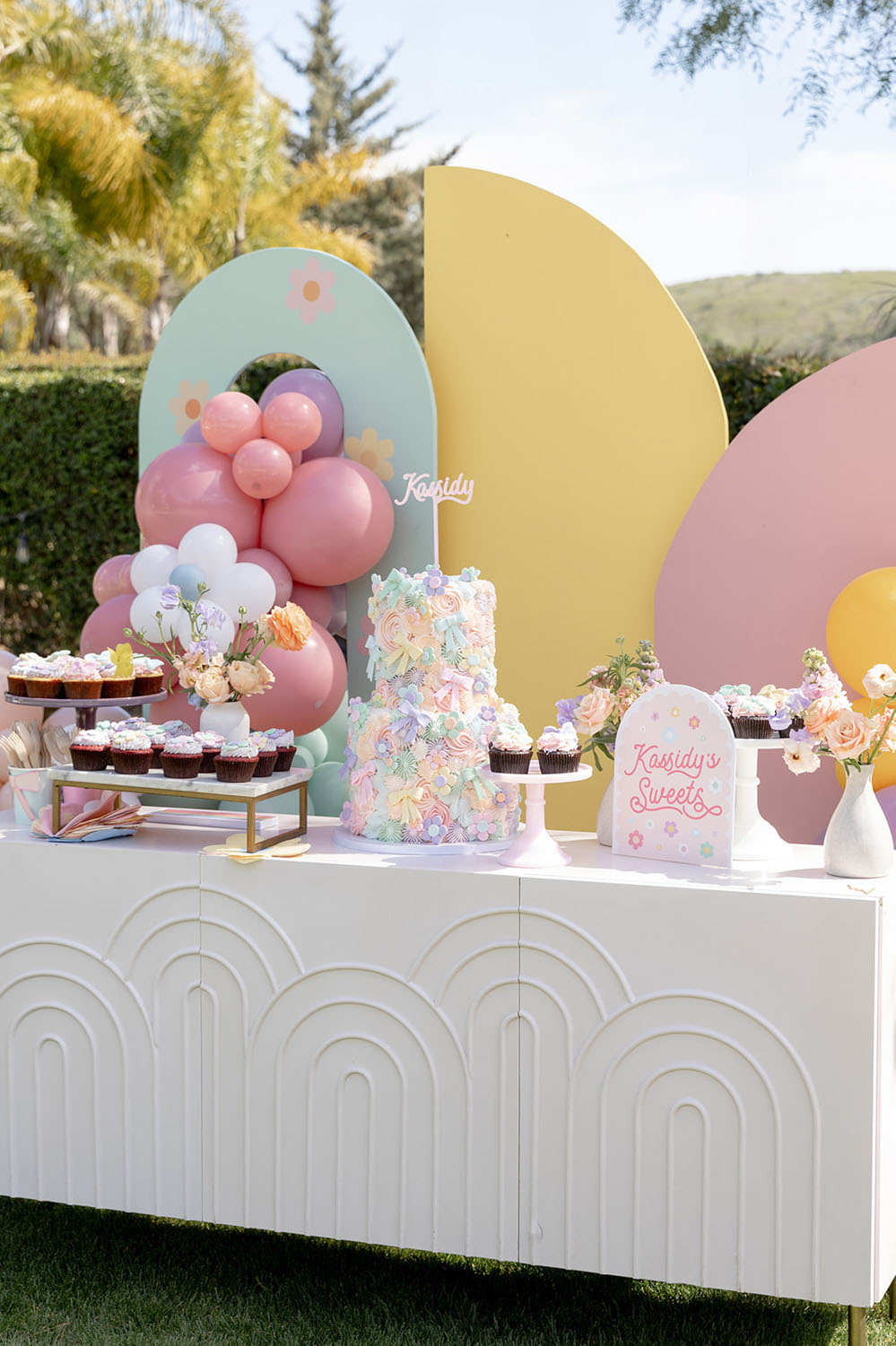 pastel dessert table for girl birthday