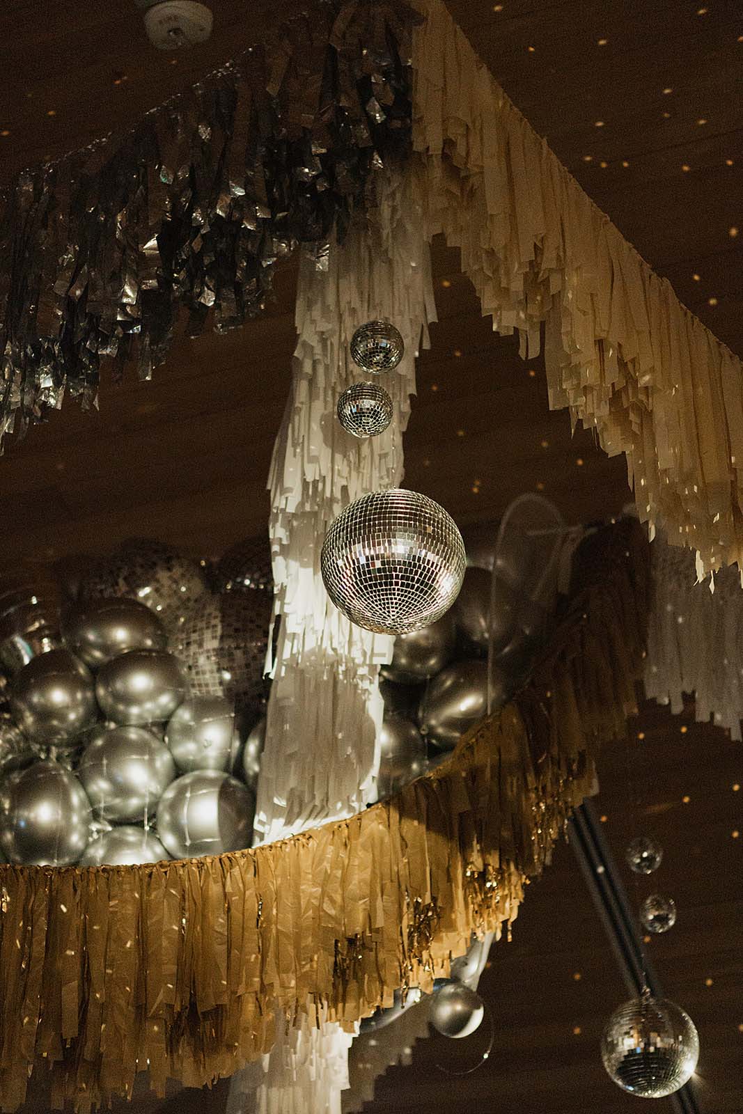 gold fringe and silver disco balls at Austin wedding reception