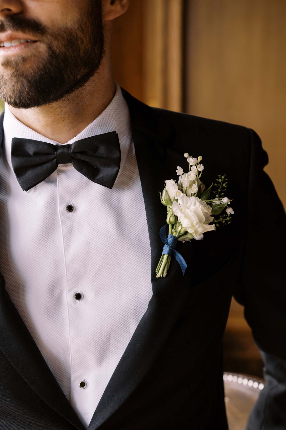 groom wearing classic black tux