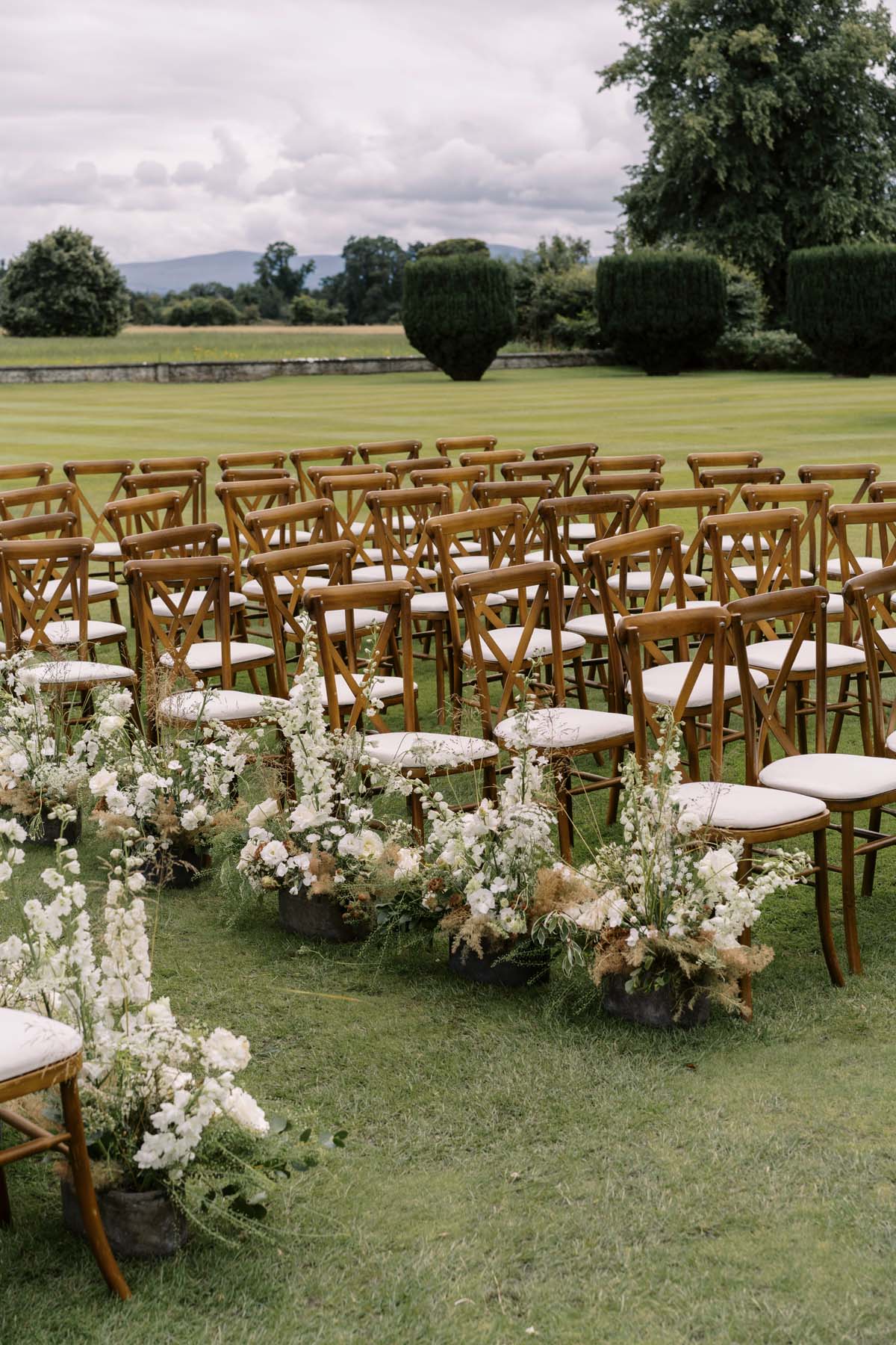 white floral arrangements for wedding ceremony