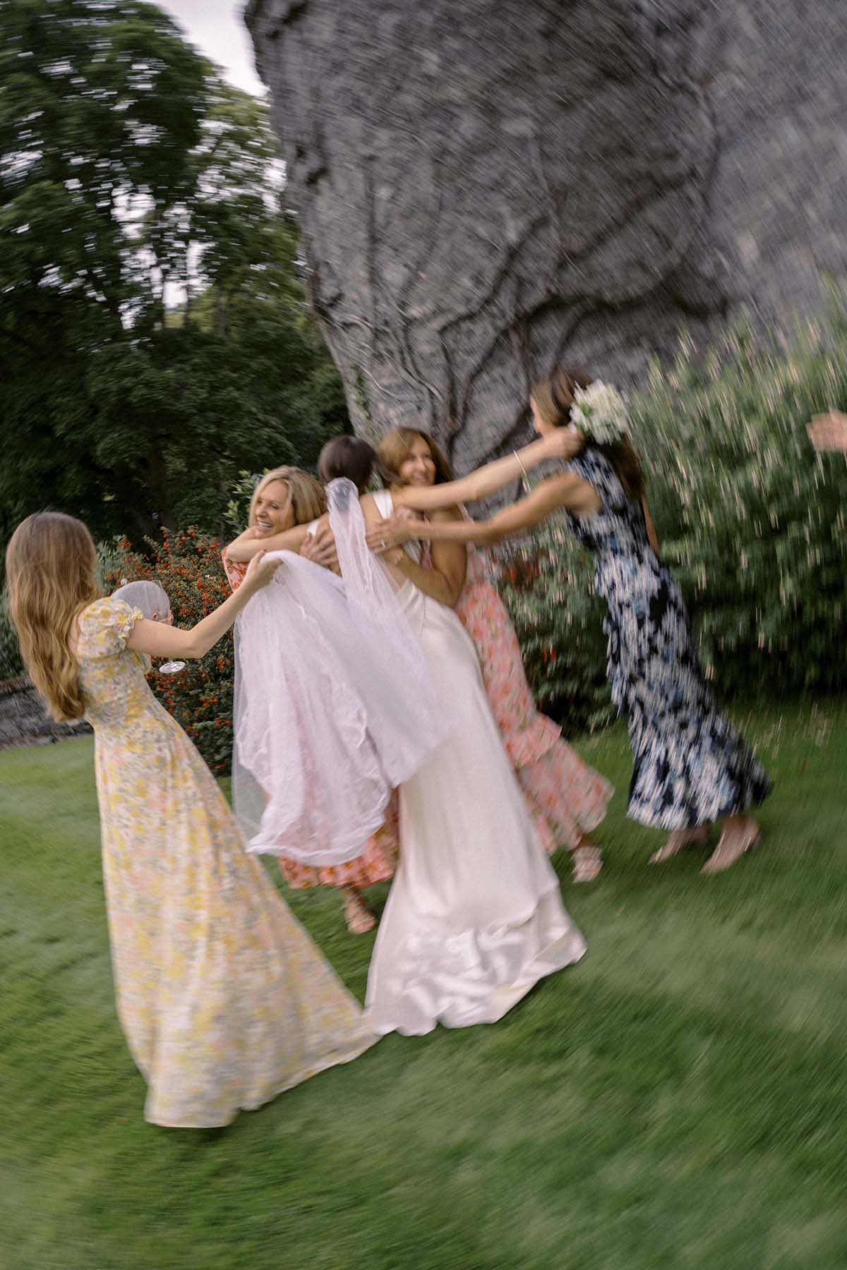 bride and wedding guests in floral dresses at Ireland wedding