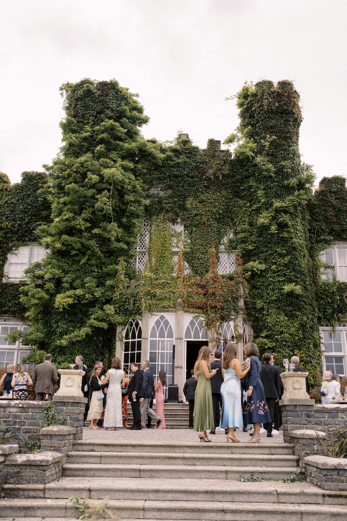 wedding guests at cocktail hour at Ireland castle wedding