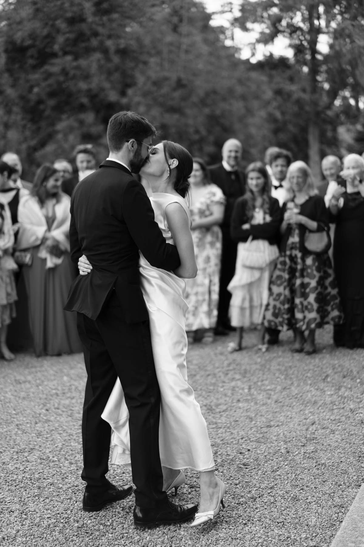 bride and groom first dance black and white photo