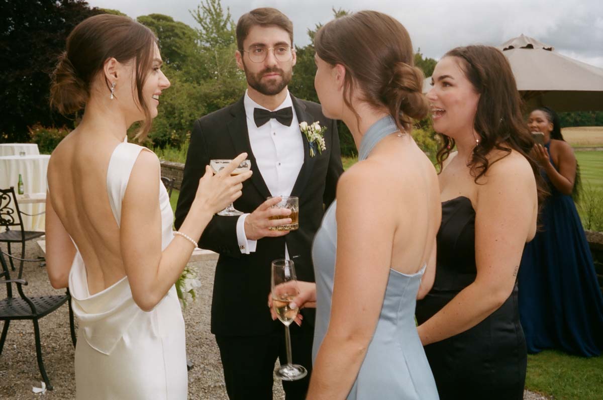 bride and groom with wedding guests at Ireland castle destination wedding