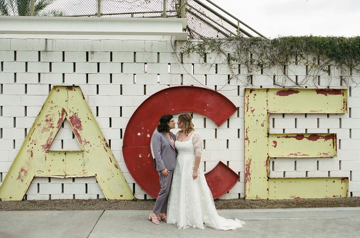 wedding portraits in front of ace hotel sign