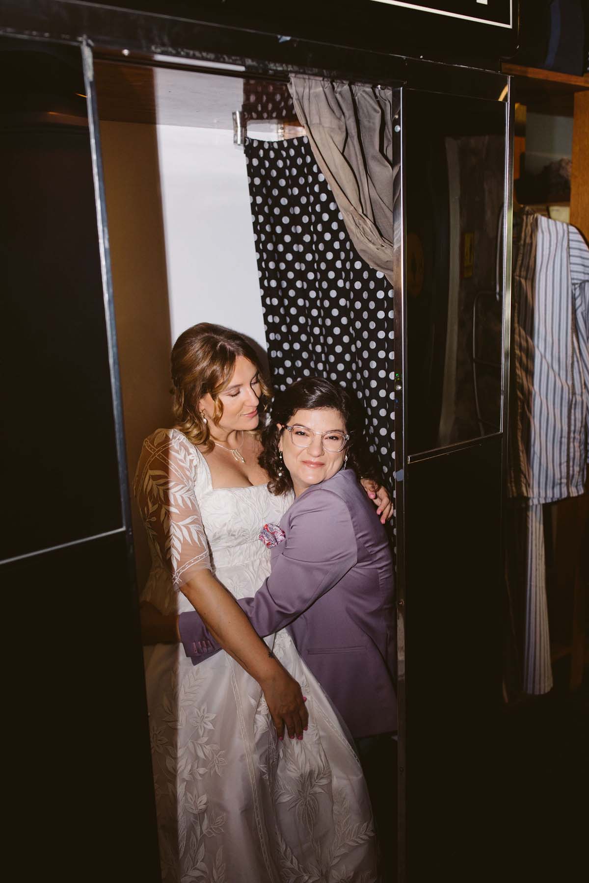 brides at wedding photo booth