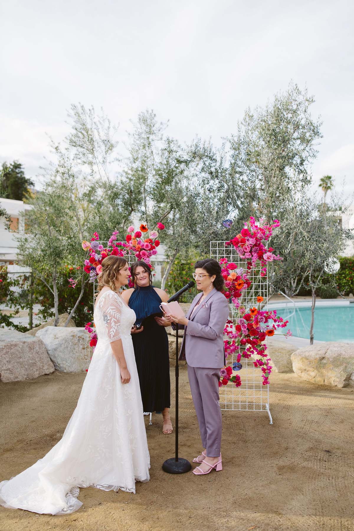 bride in lavender wedding suit