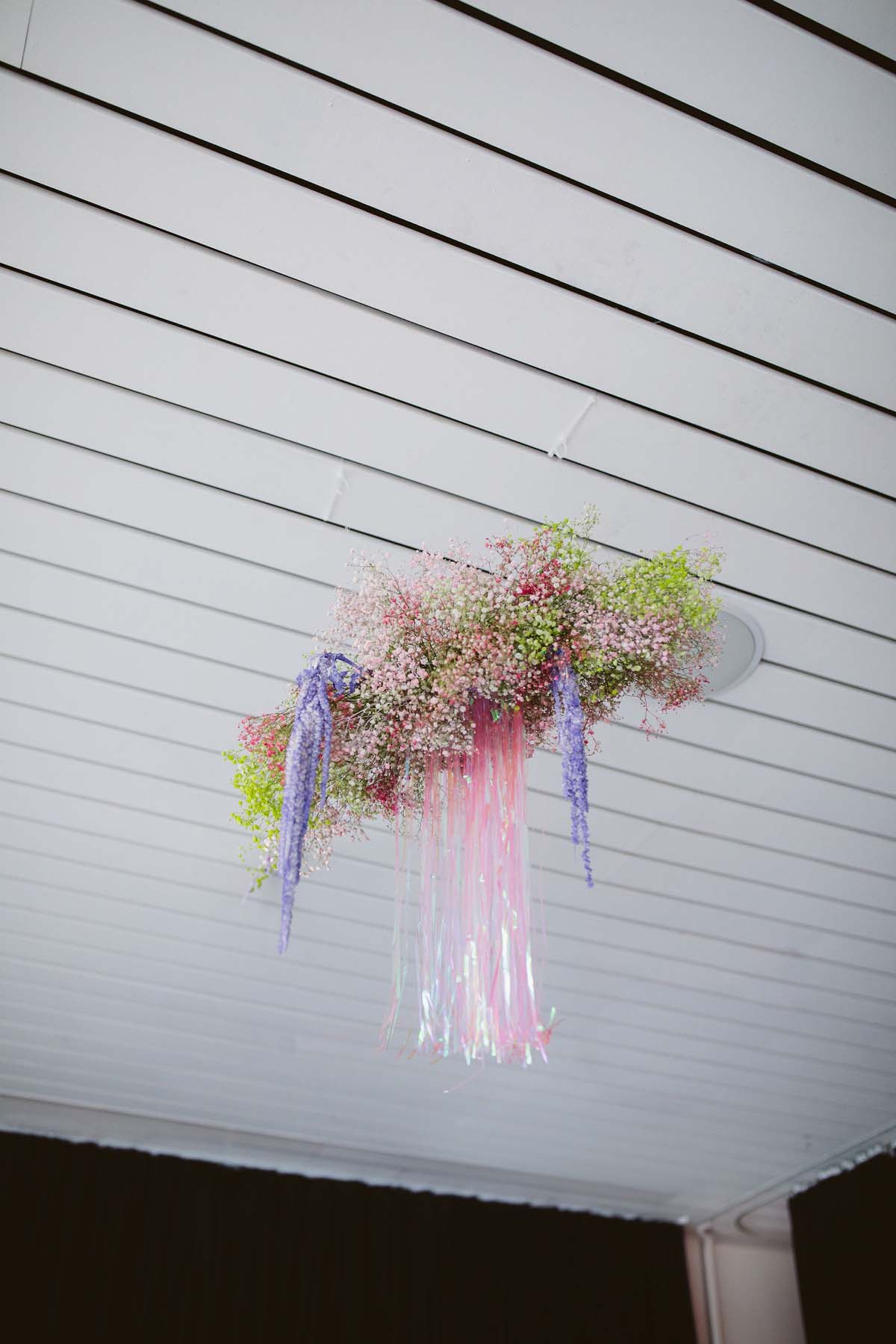 purple and pink wedding decor with babies breath