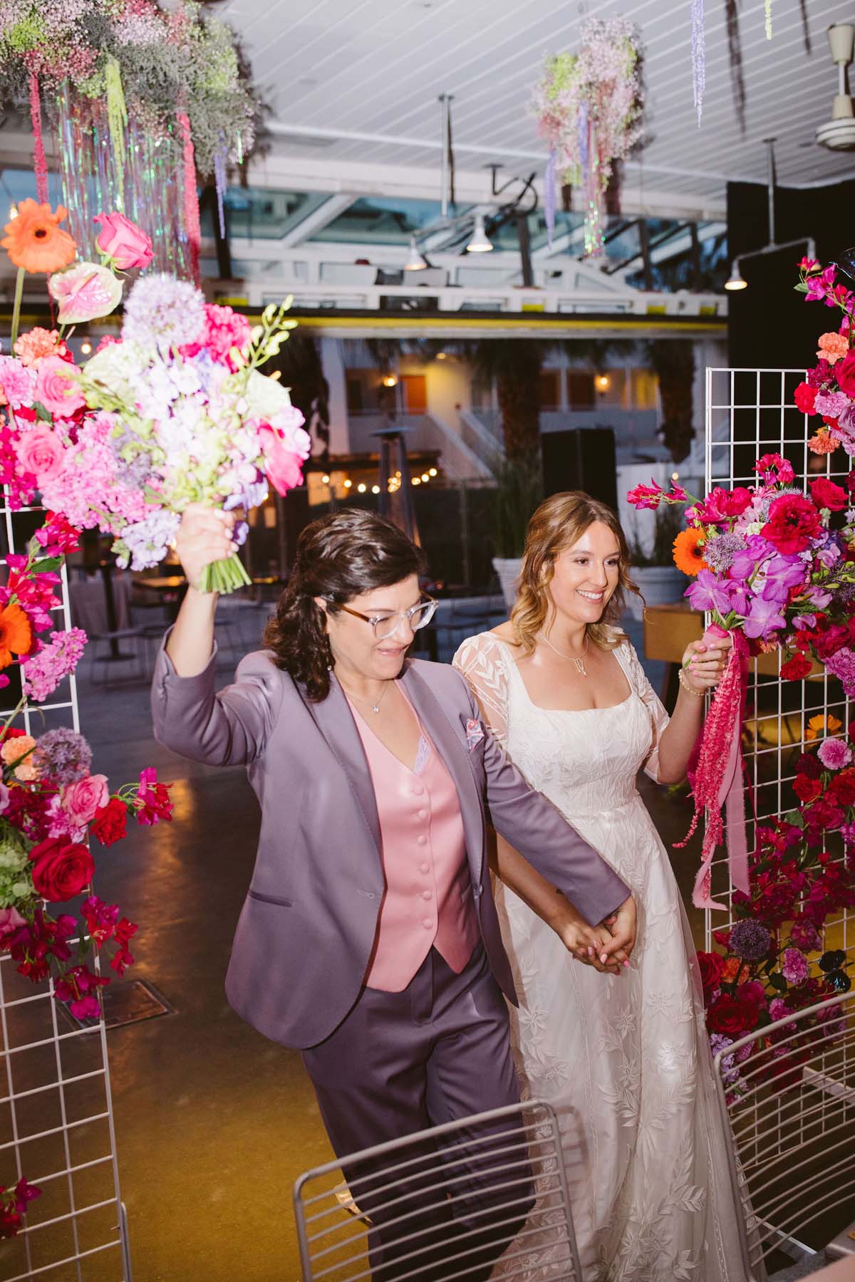 brides wedding reception entrance with pink and purple wedding decor