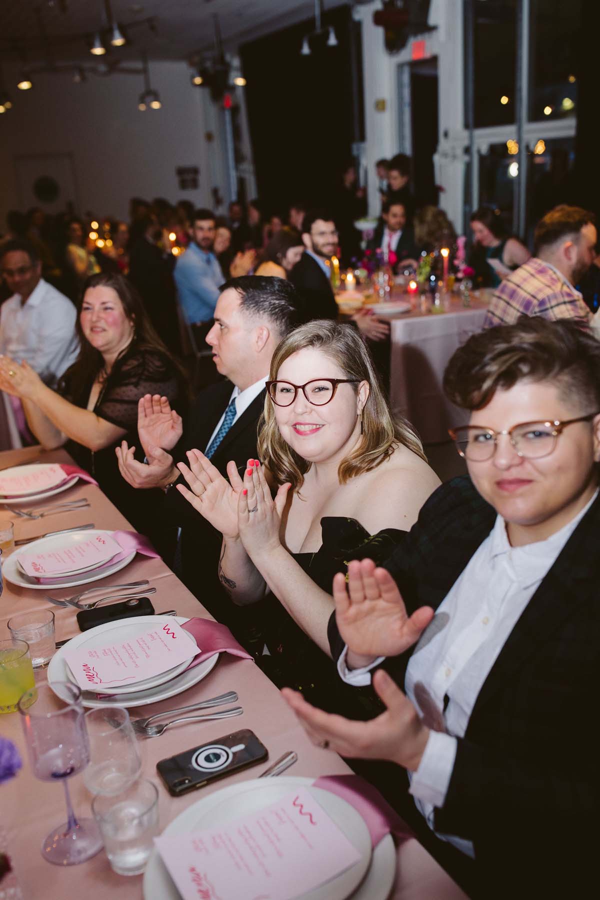 guests at pink and purple palm springs wedding