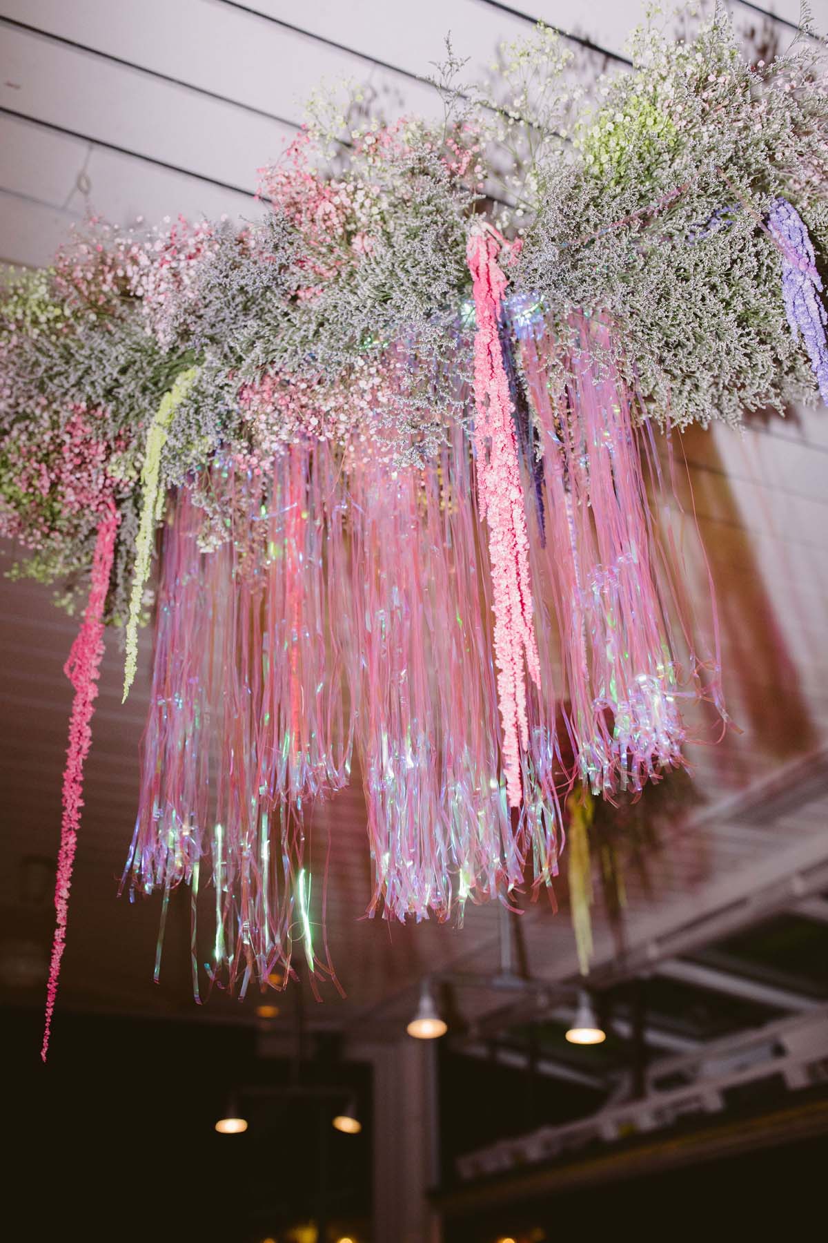 pink fringe and babies breath for 90s 2000s inspired wedding decor