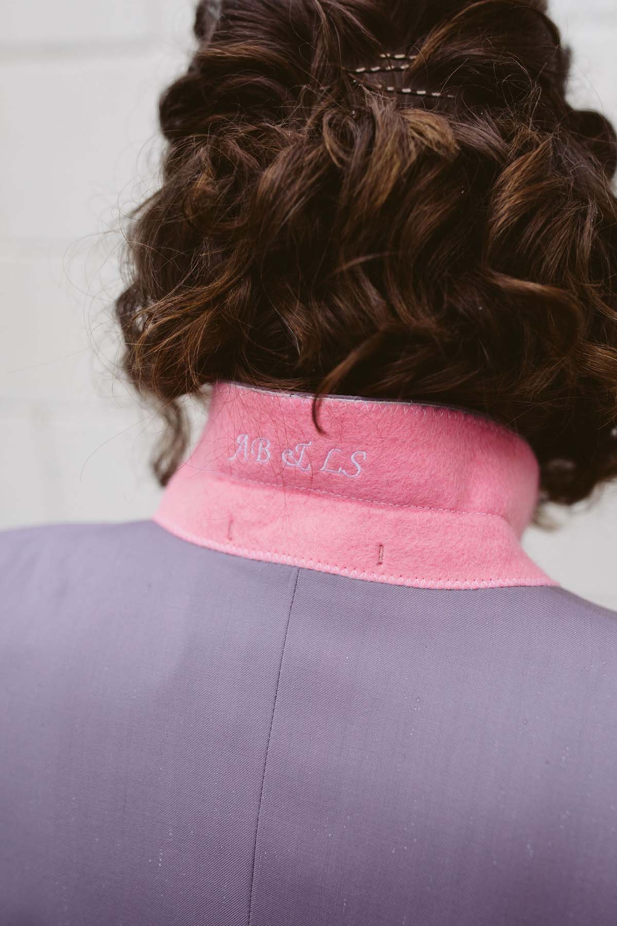 custom pink collar on purple suit