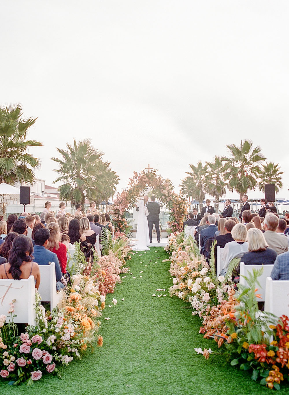 lush floral wedding ceremony at Hotel Del Coronado