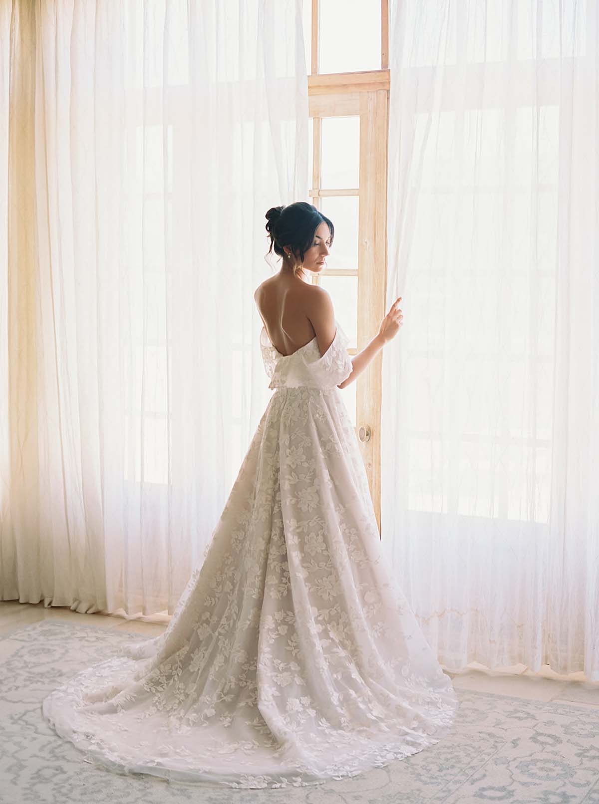 bride wearing lace dress at Sunstone Villa wedding