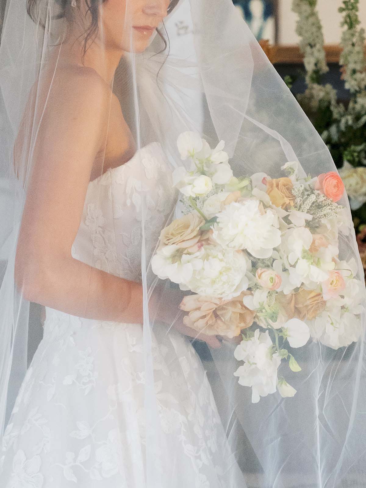 romantic white bridal bouquet and veil