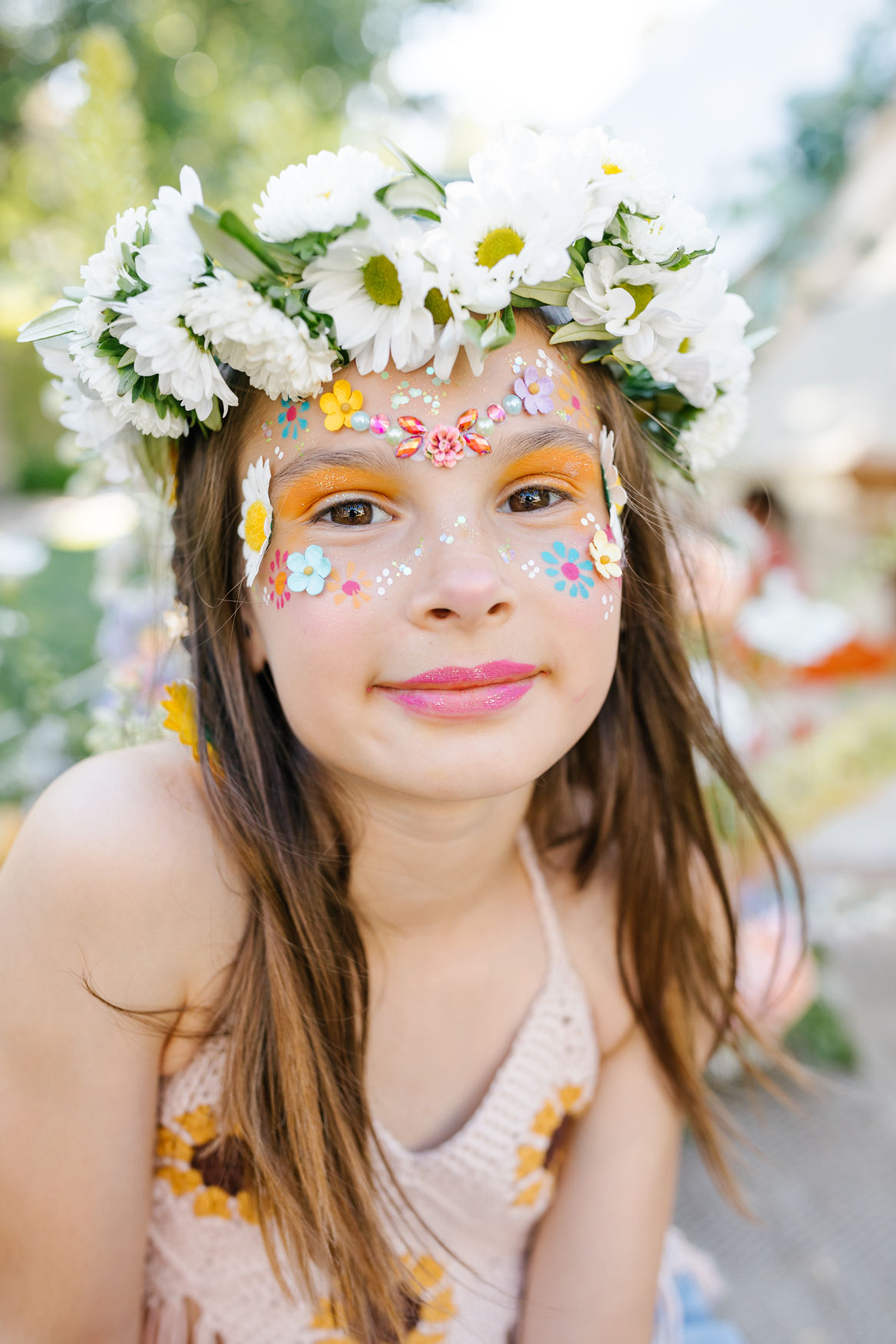 groovy flower child face painting and floral crown for girls birthday party