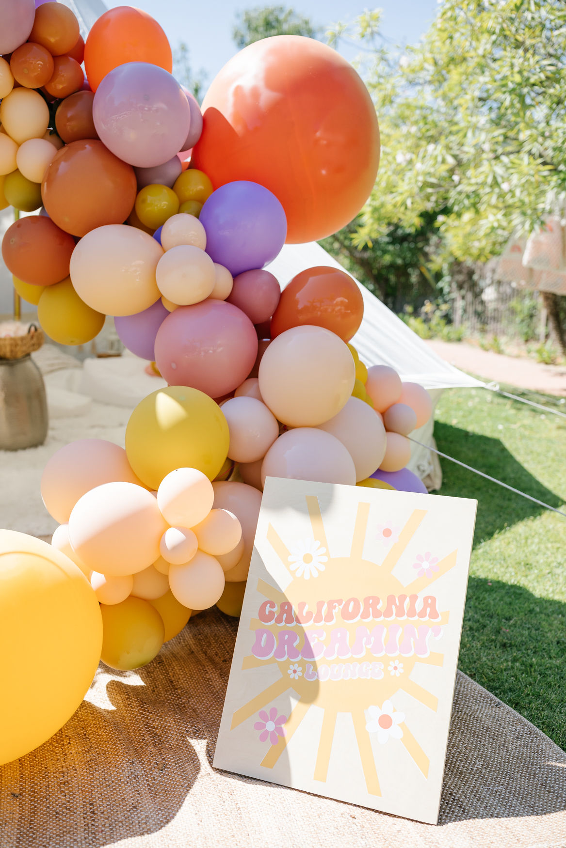 Groovy lounge sign with colorful balloon decorations