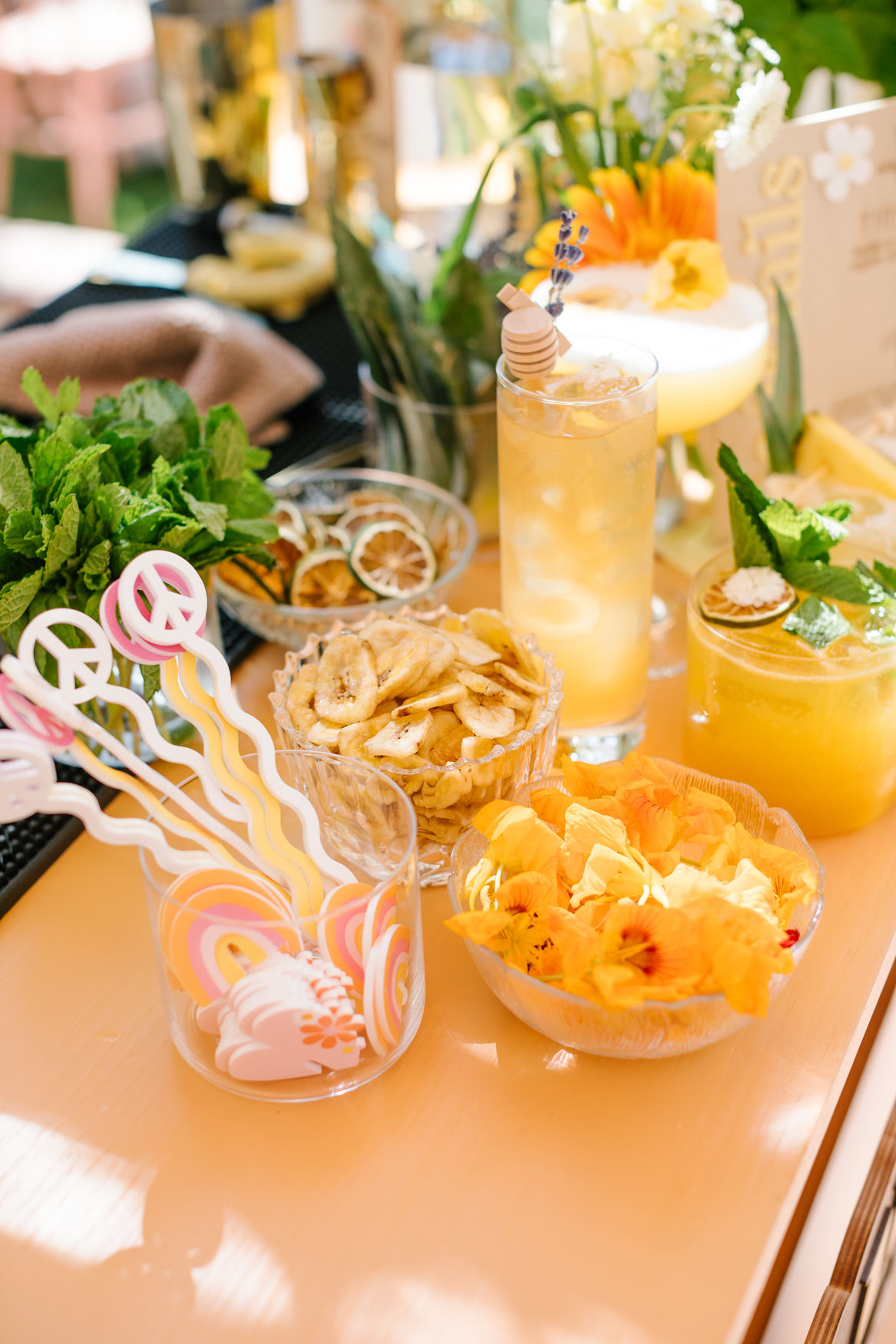 cocktails and peace sign stir sticks for groovy birthday party