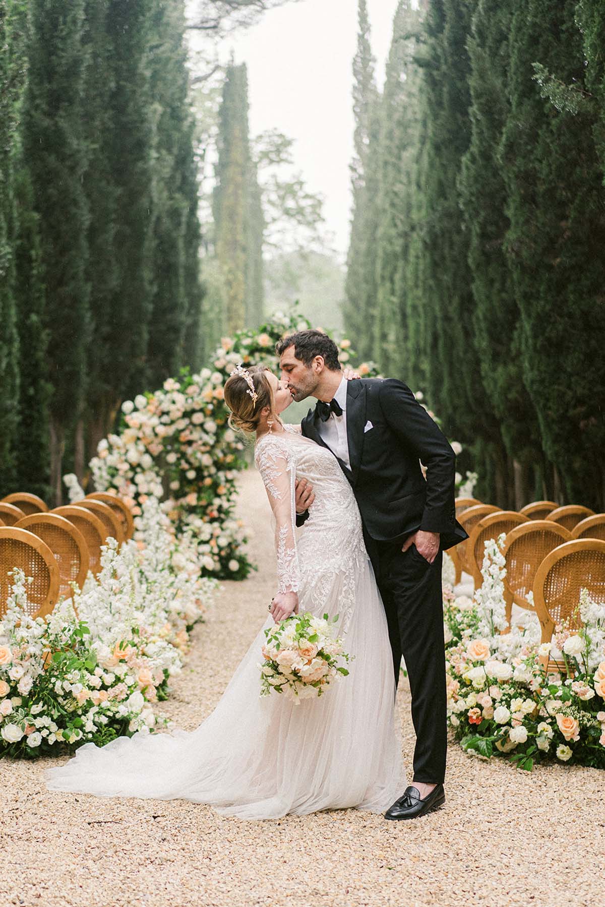 elegant floral arch with roses for wedding ceremony at Château Martinay, France