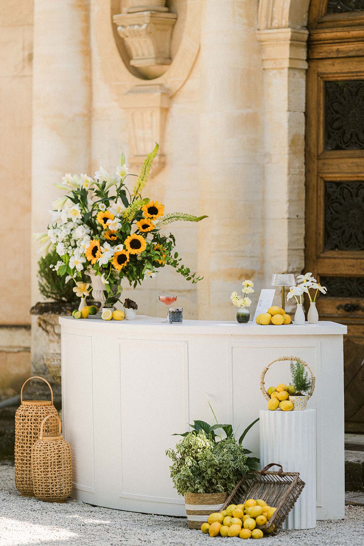 bar with sunflowers and lemons at summer Chateau Martinay wedding