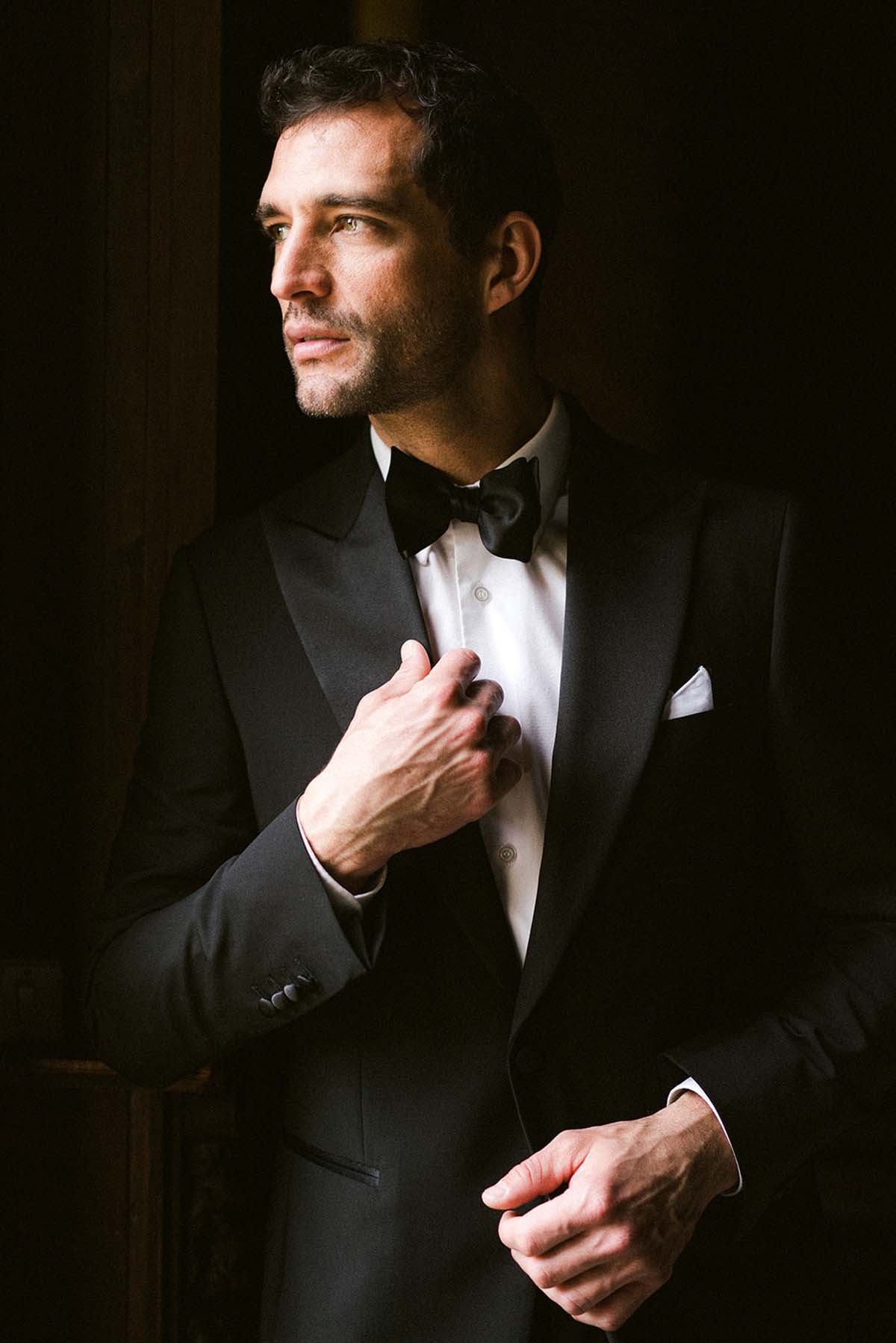 elegant groom in classic black tuxedo