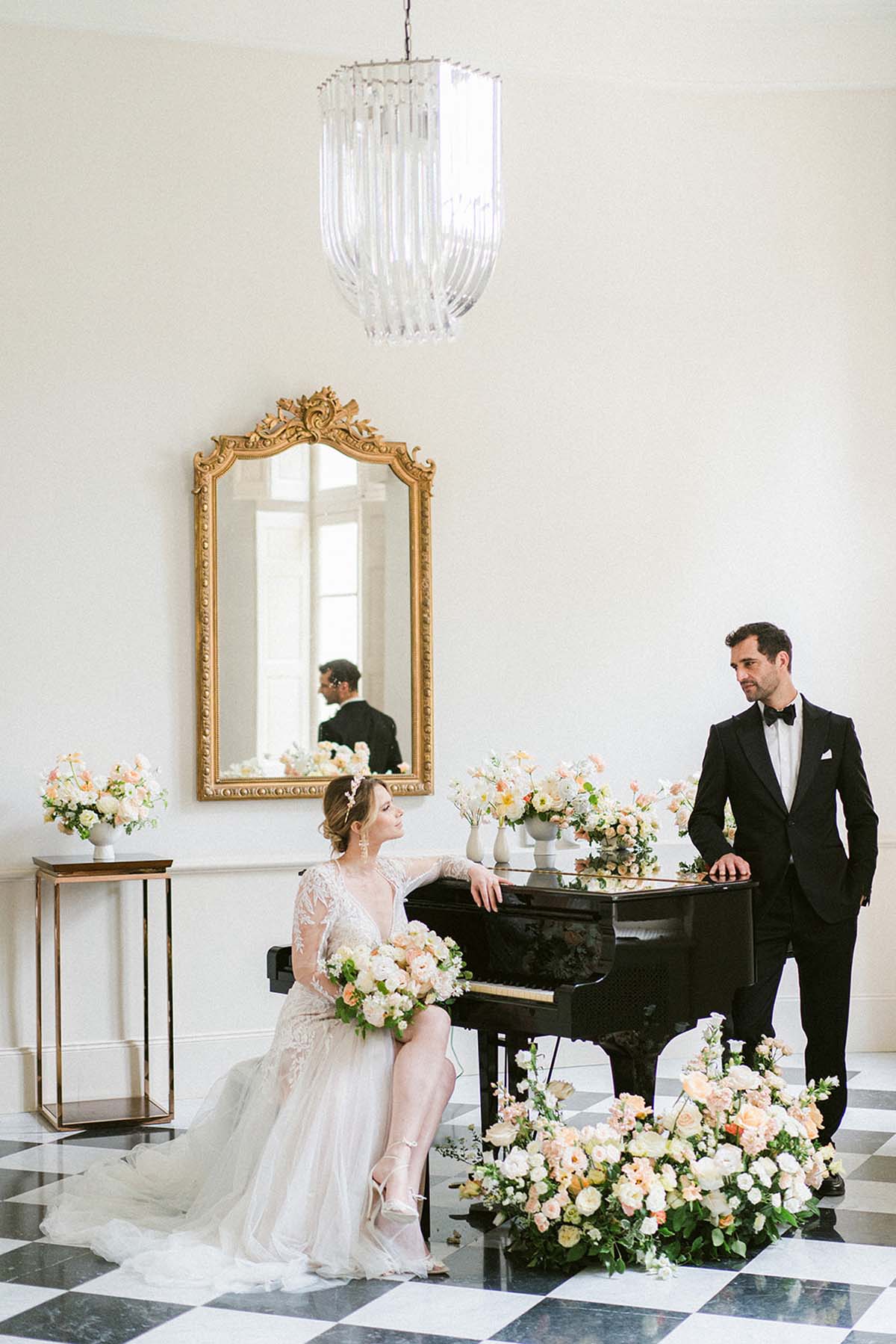 elegant bride and groom portrait at piano in Chateau Martinay wedding venue