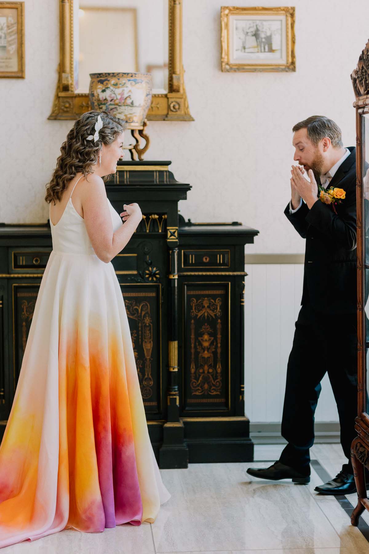 first look with bride wearing colorful wedding dress