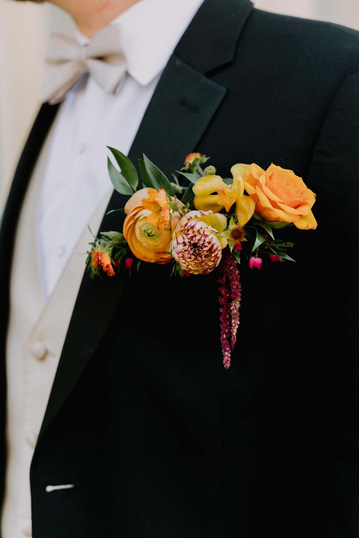 orange ranunculus boutonniere 