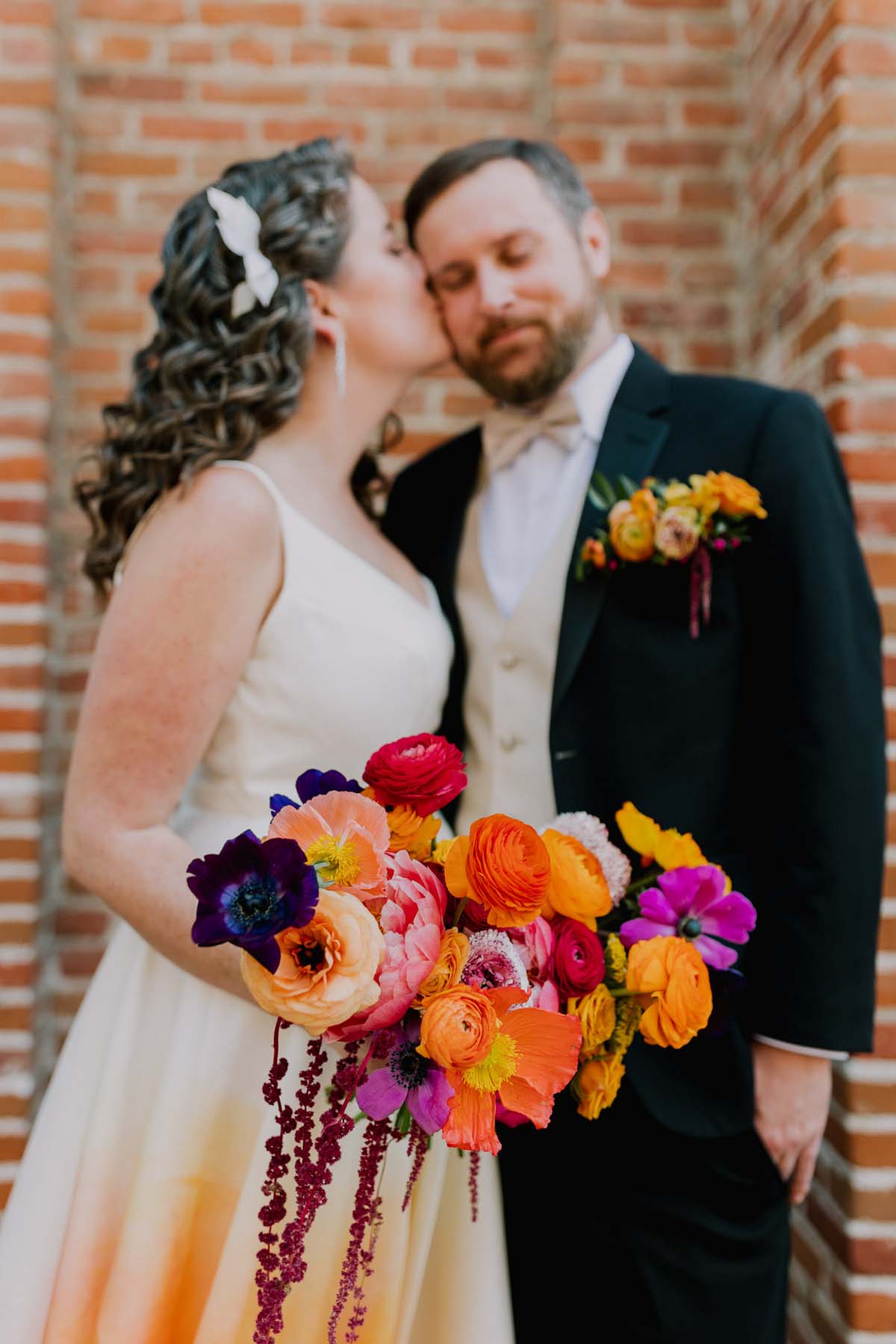 wedding portraits with colorful wedding dress and bouquet