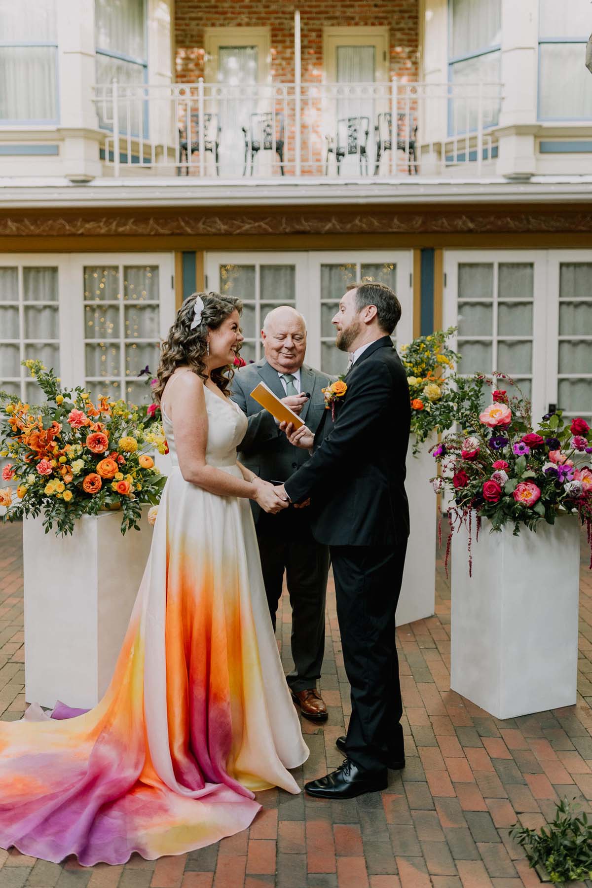 bride in colorful wedding dress at ceremony at New Children's Museum San Diego