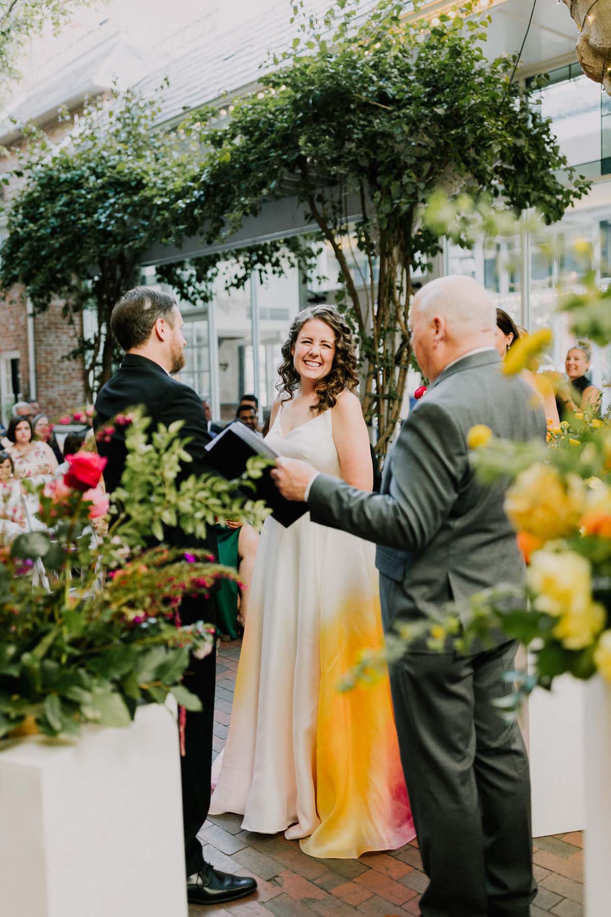 bride in colorful wedding dress at ceremony at New Children's Museum San Diego