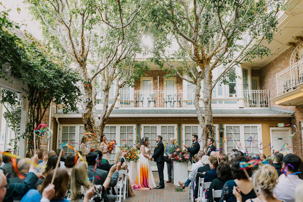 bride in colorful wedding dress at ceremony at New Children's Museum San Diego