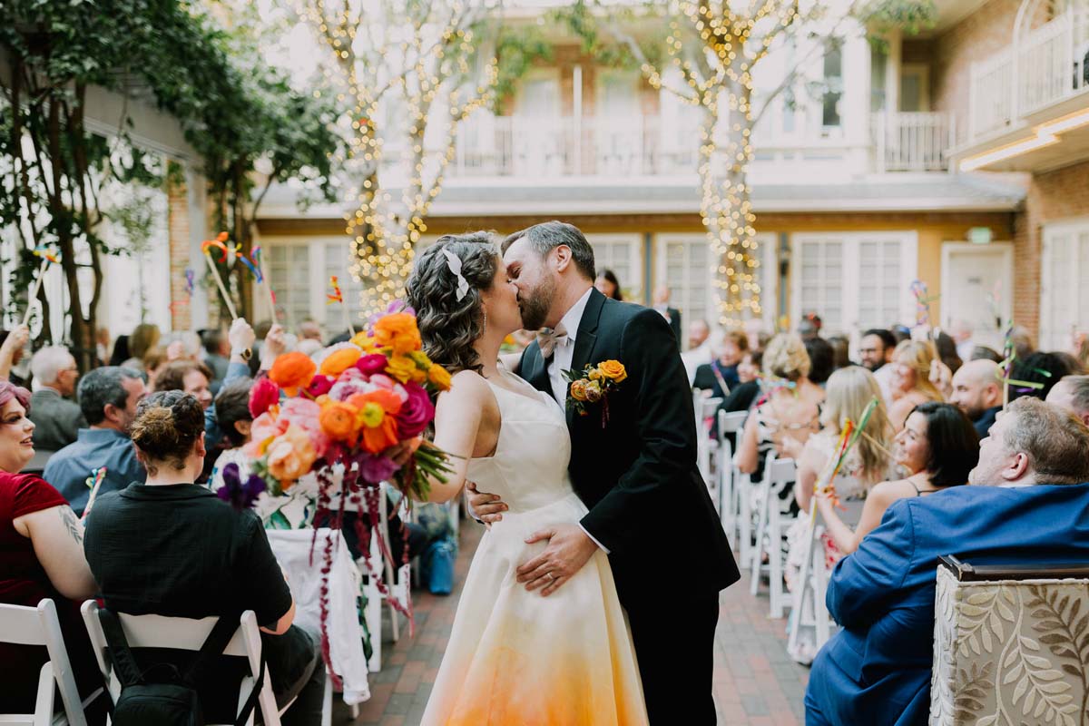 bride in colorful wedding dress at ceremony at New Children's Museum San Diego