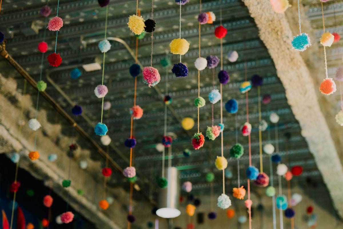 rainbow pom pom decor at wedding