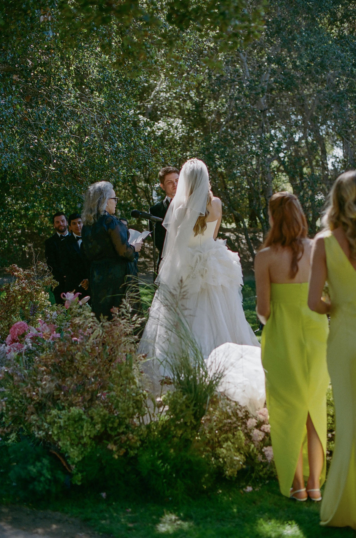 bride and yellow bridesmaids at elegant black tie wedding in Carmel Valley Ranch