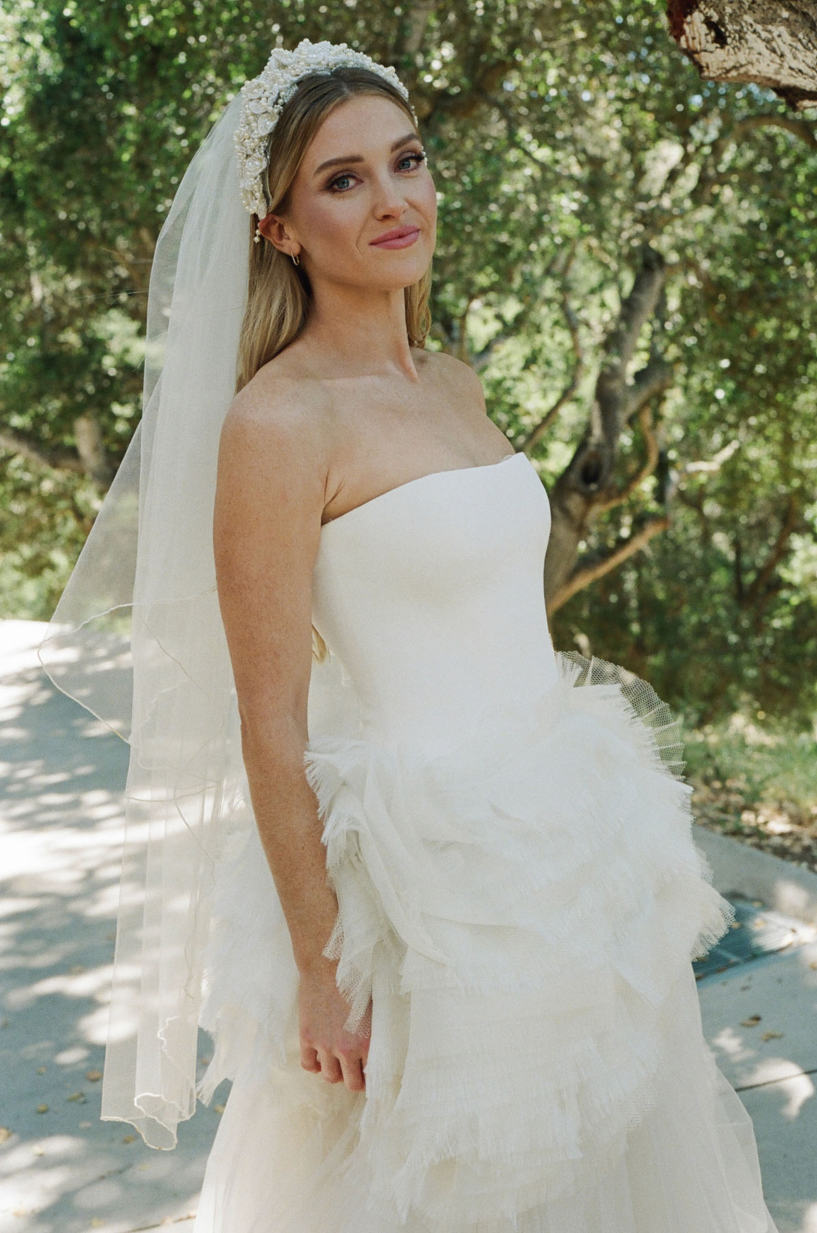 bride wearing vera wang and wedding headband with veil