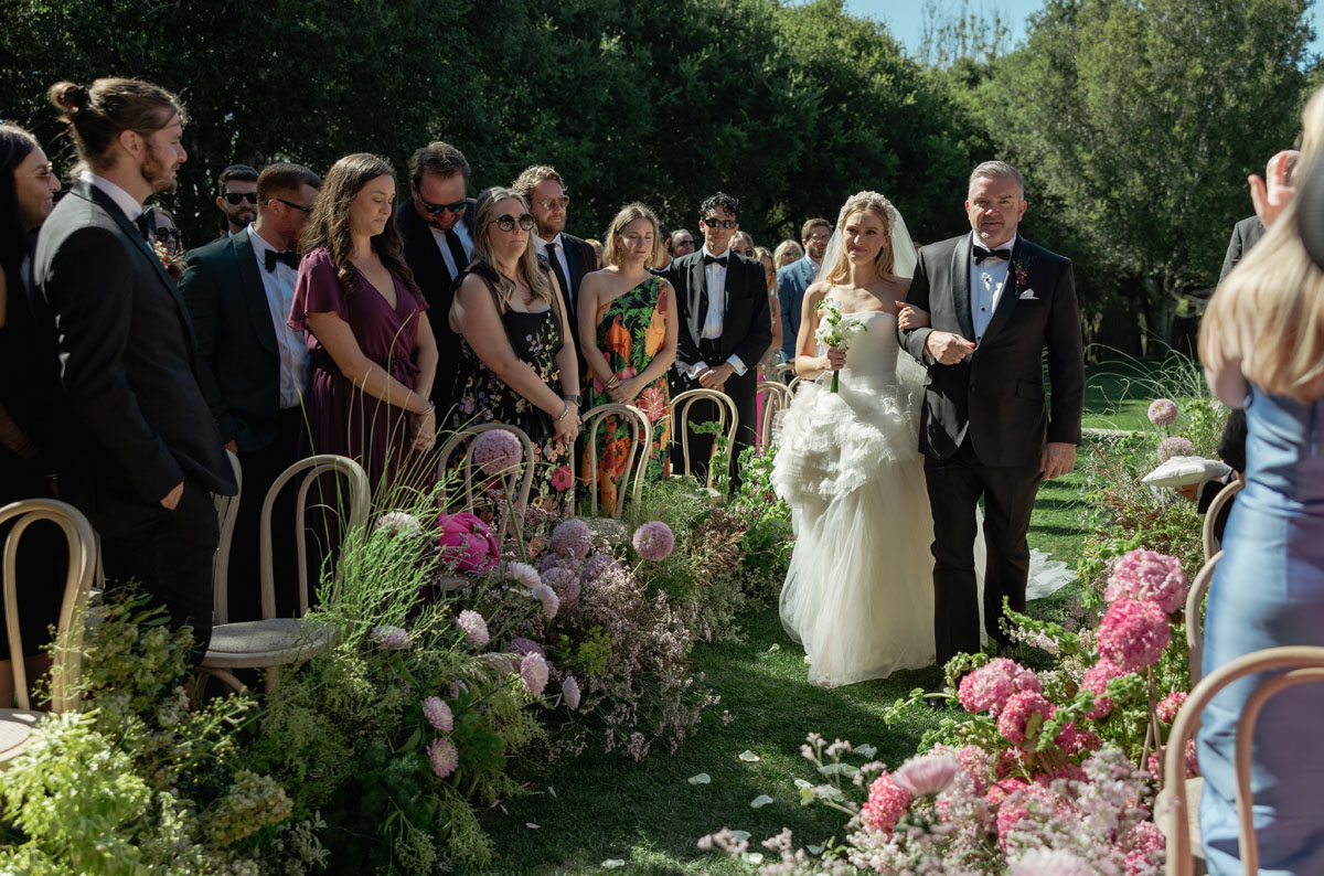 bride and dad walking down aisle