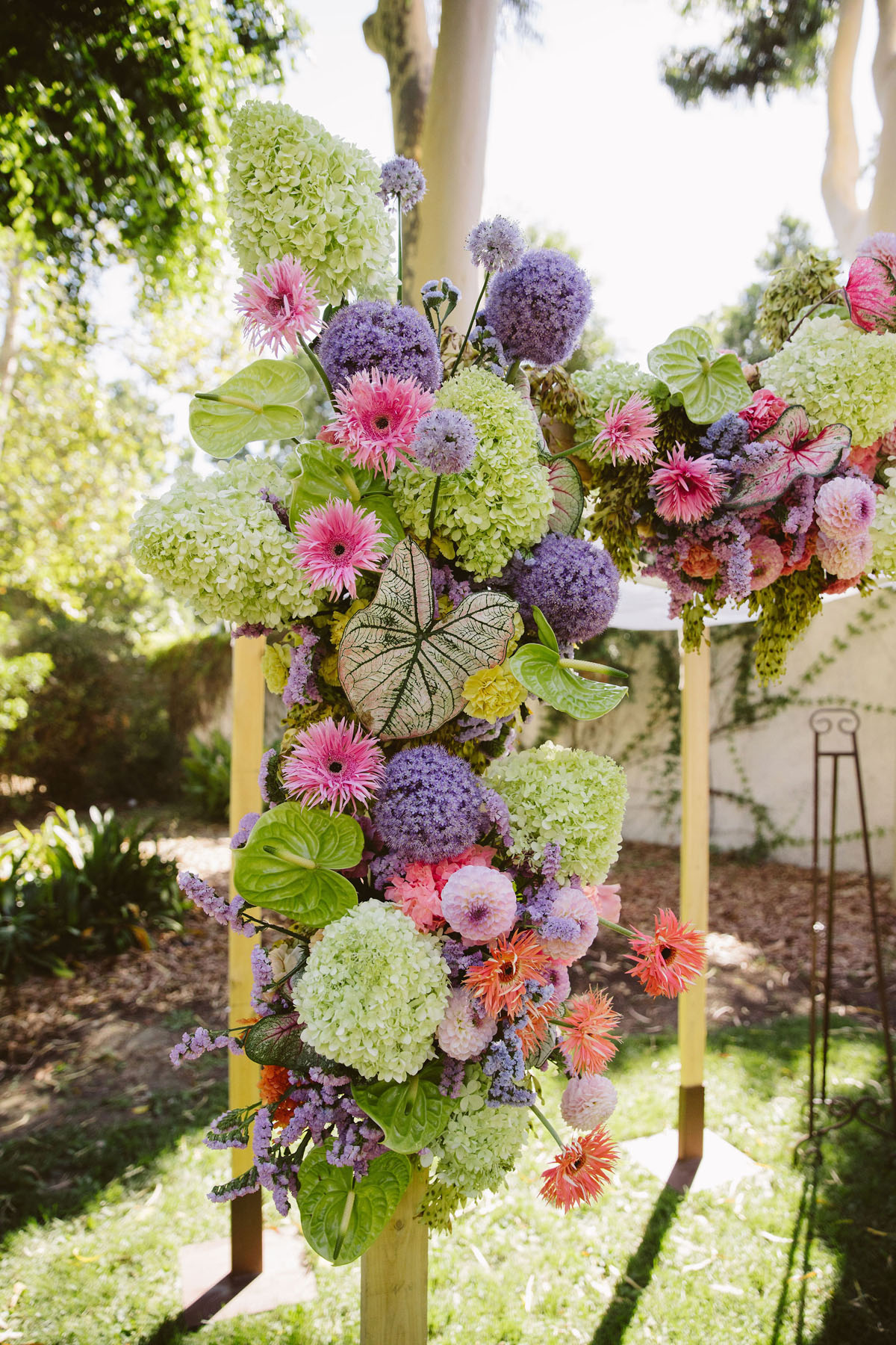 colorful pink, green, lilac floral chuppah for jewish wedding