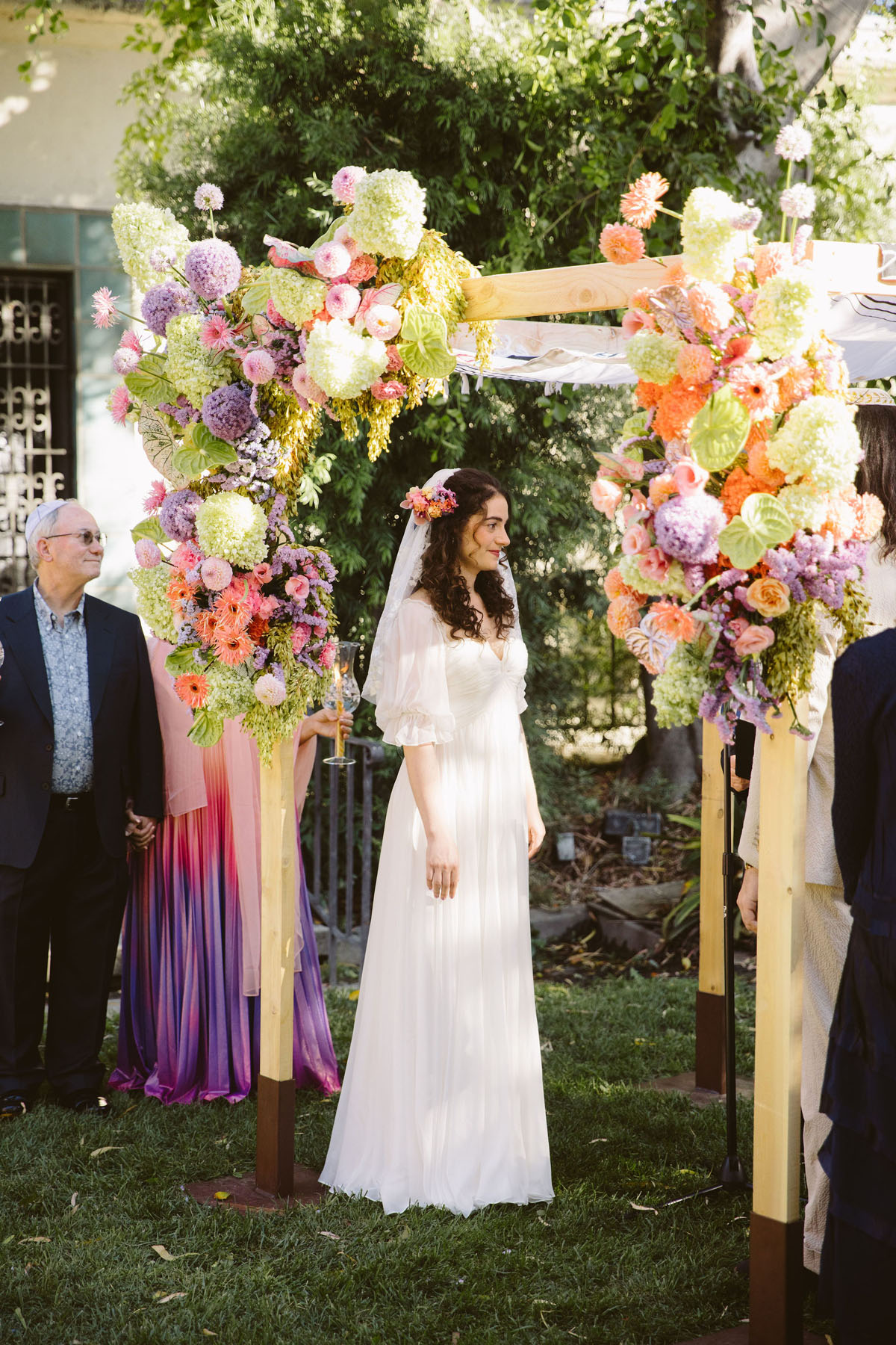 gorgeous floral chuppah and bride