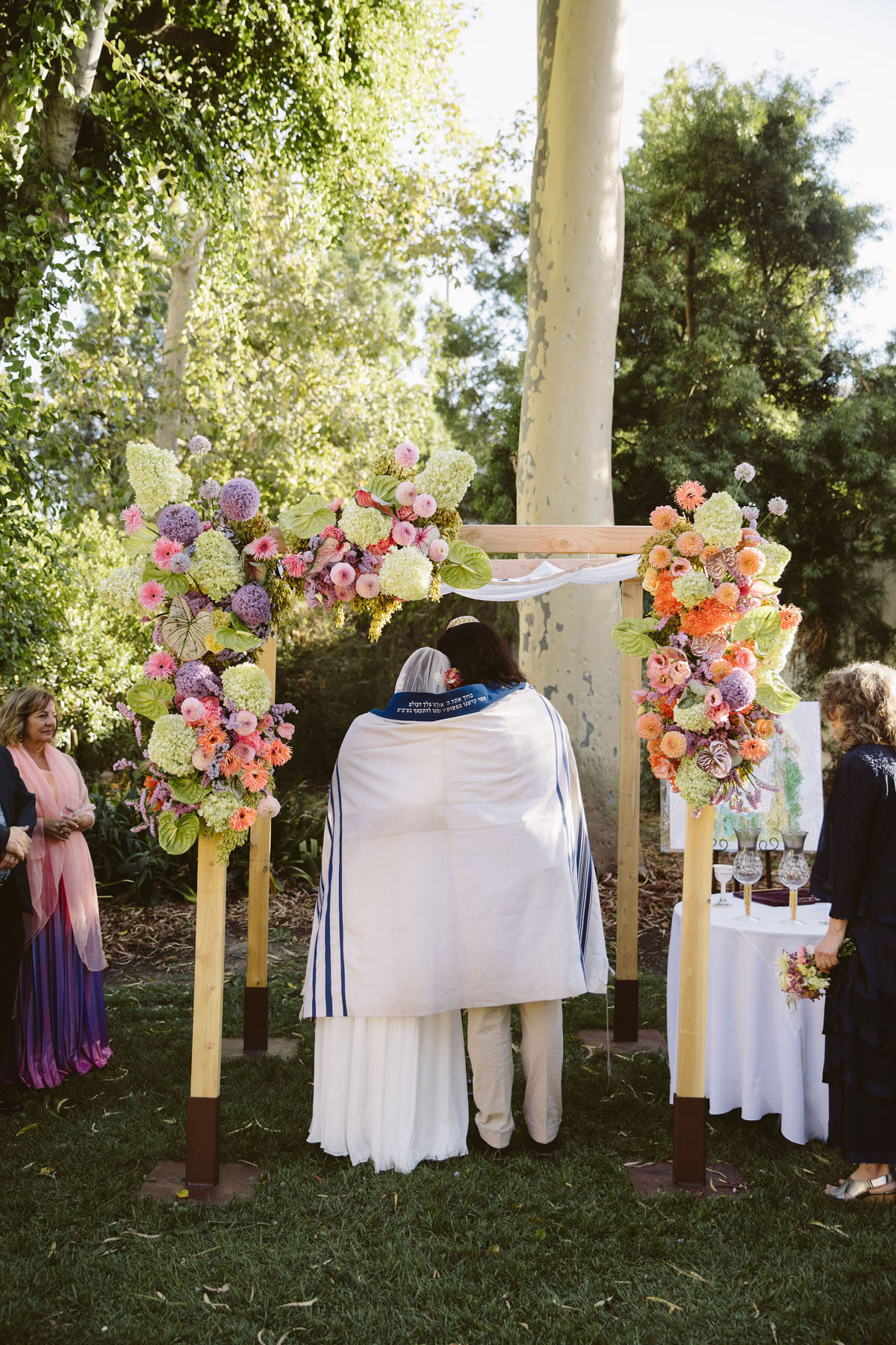 bride and groom at colorful jewish wedding ceremony in Los Angeles