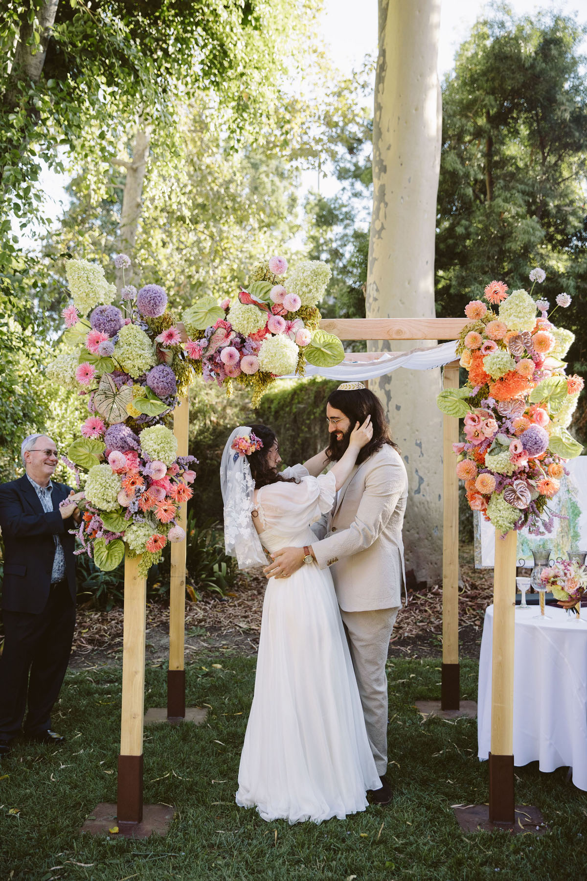 bride and groom at colorful jewish wedding ceremony in Los Angeles