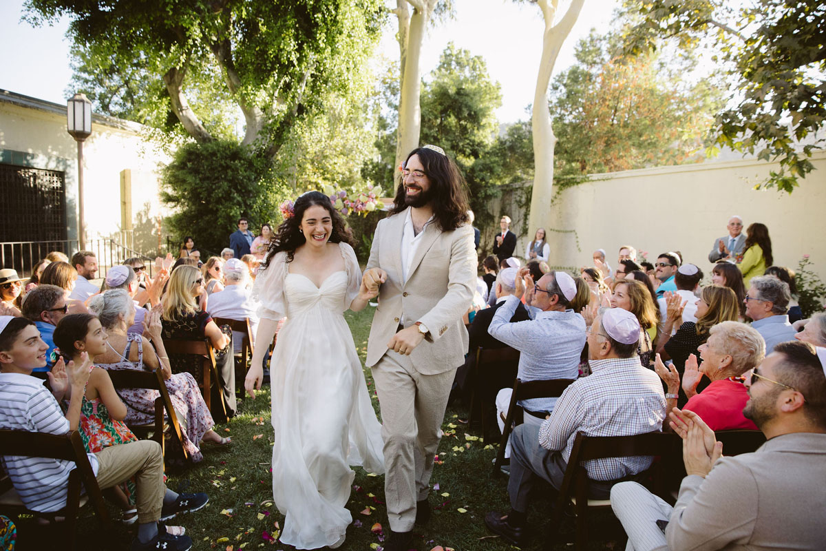 bride and groom at colorful jewish wedding ceremony in Los Angeles