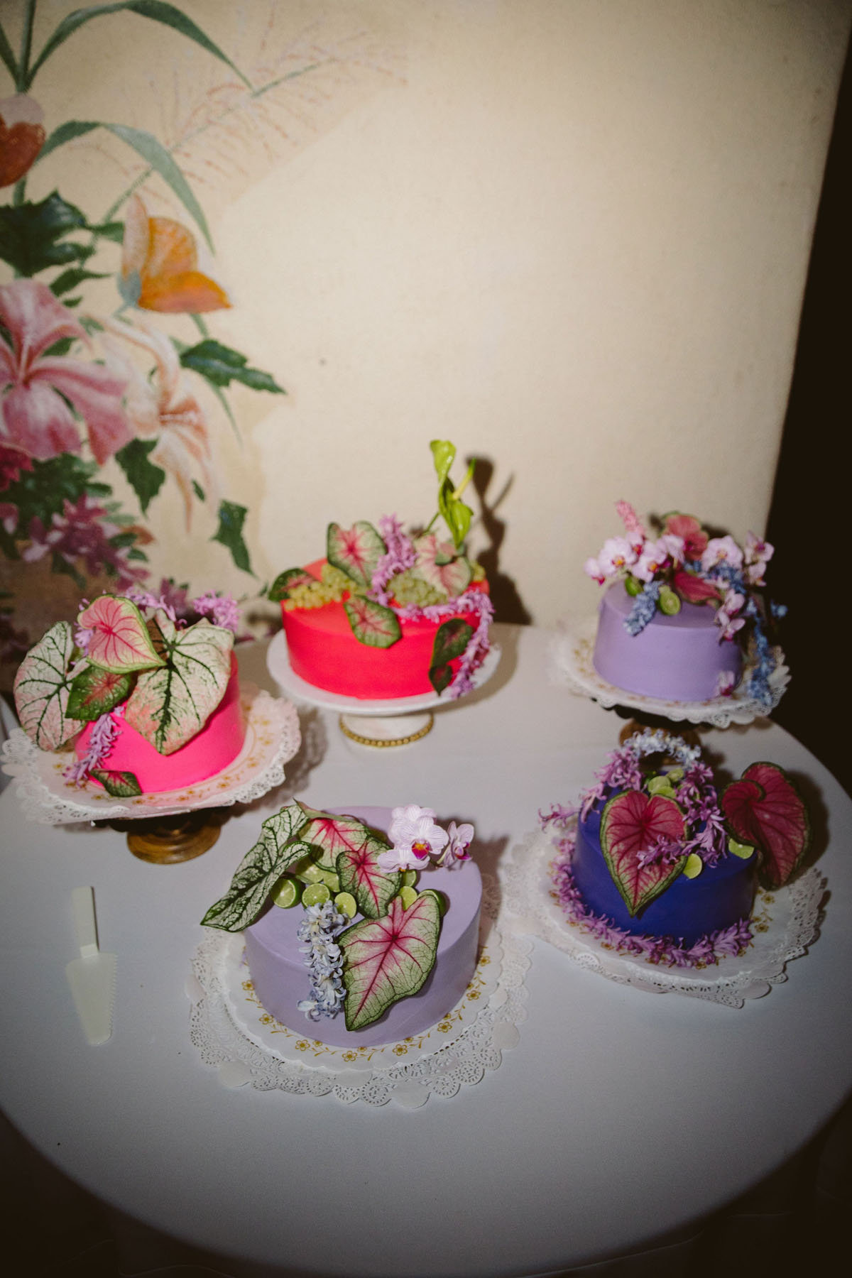 pink purple and green funky wedding cakes with leaves and flowers