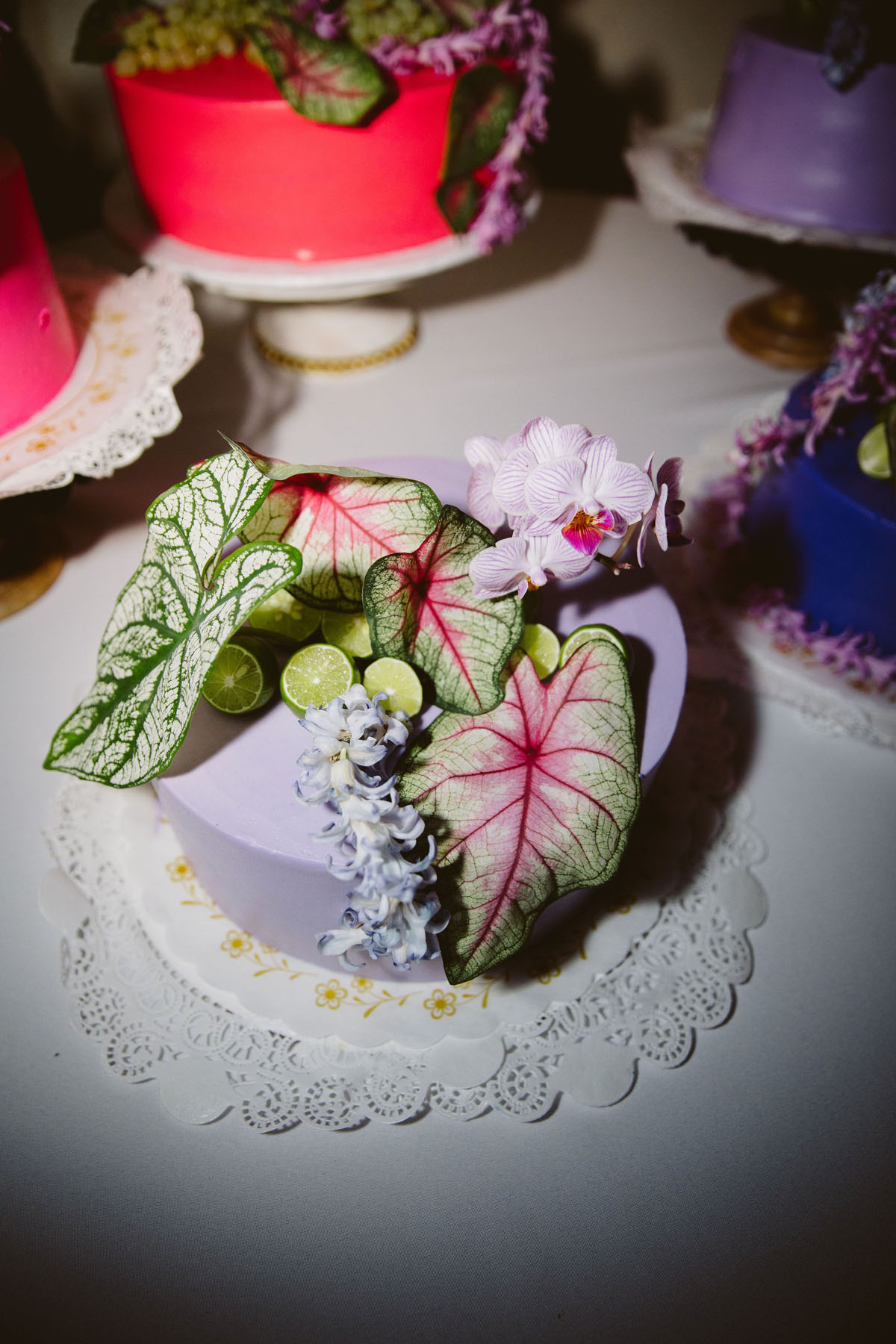 pink purple and green funky wedding cakes with leaves and flowers